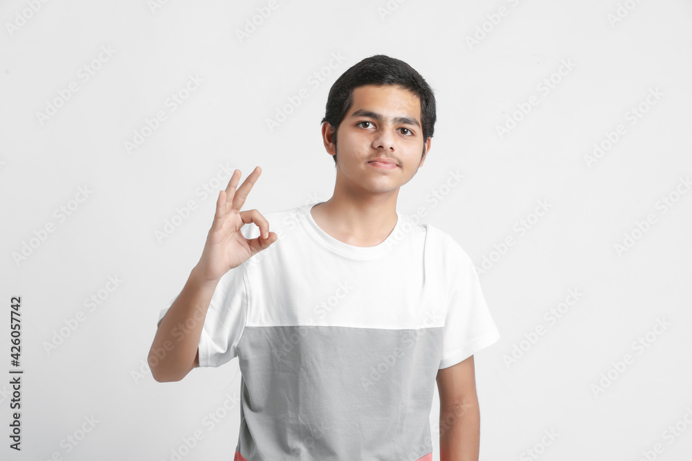 young indian boy showing expression on white background young indian boy showing expression on white background