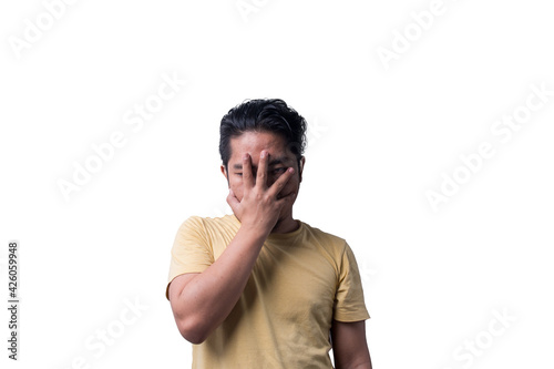 Face reaction, Asian young man portrait of face expression, shocked, thrilled, scared, surprised, with covered face with hand. Isolated, selective focus, copy space