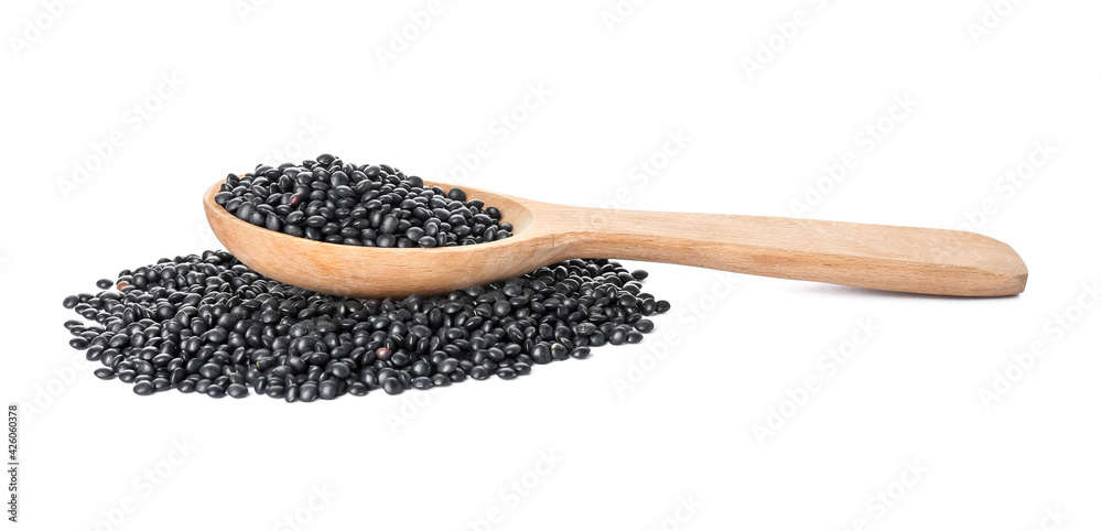 Spoon with black lentils on white background Spoon with black lentils on white background