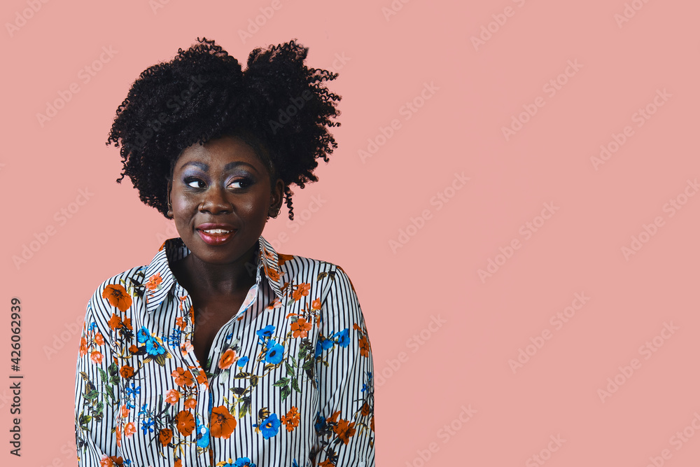 Studio portrait of African American woman looking to the side at copy space Studio portrait of African American woman looking to the side at copy space