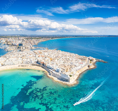 White sand beach washed by the turquoise sea surrounding Gallipoli, aerial view, Lecce province, Salento, Apulia, Italy photo