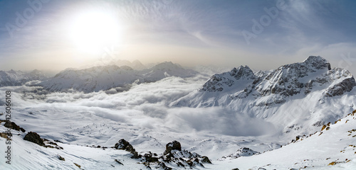 Panoramic of snow capped mountains of Upper Engadine from Piz Nair, canton of Graubunden, Switzerland photo