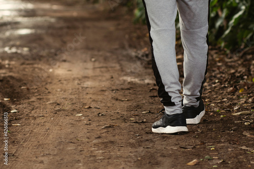 Young latin man walking in the forest