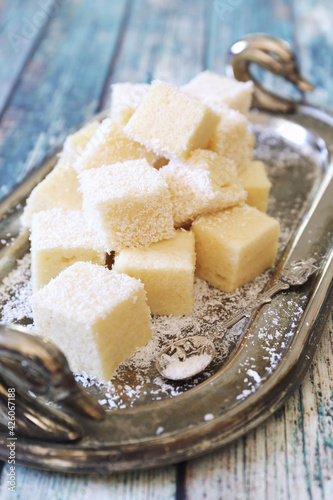 Apple gelatin dessert. Sugar free. Homemade marshmallow cubes in coconut flakes