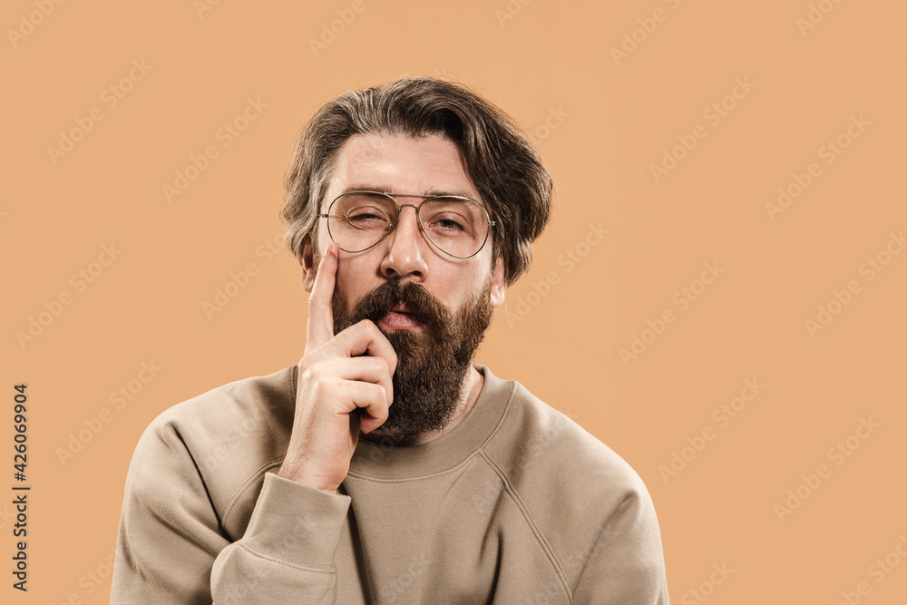 Half-length portrait of Caucasian man isolated over light yellow background. Half-length portrait of Caucasian man isolated over light yellow background.