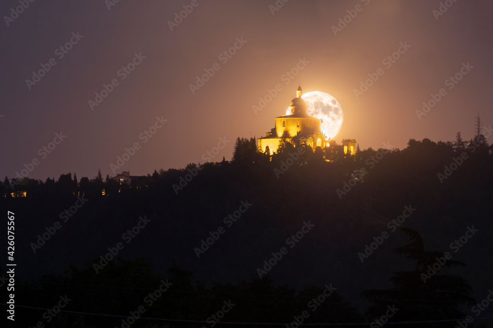Full moon rising behind San Luca Basilica in Bologna, Emilia Romagna, Italy Full moon rising behind San Luca Basilica in Bologna, Emilia Romagna, Italy