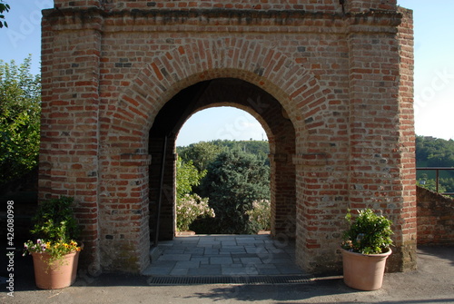 under the medieval tower of Pavarolo there is an ancient brick portal from which one ascends to the bell tower and enters the ancient village.