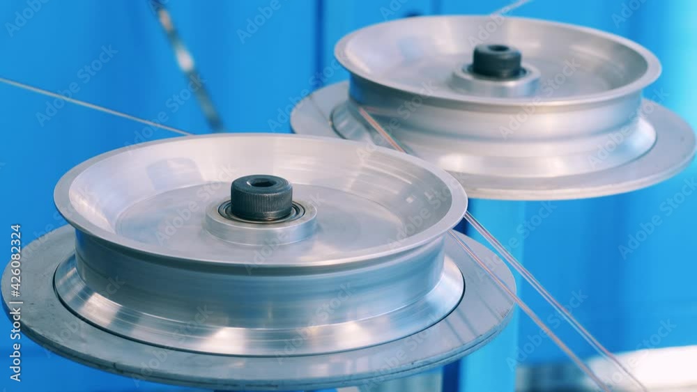 Two shafts spinning. Cable manufacturing process Two shafts spinning. Cable manufacturing process