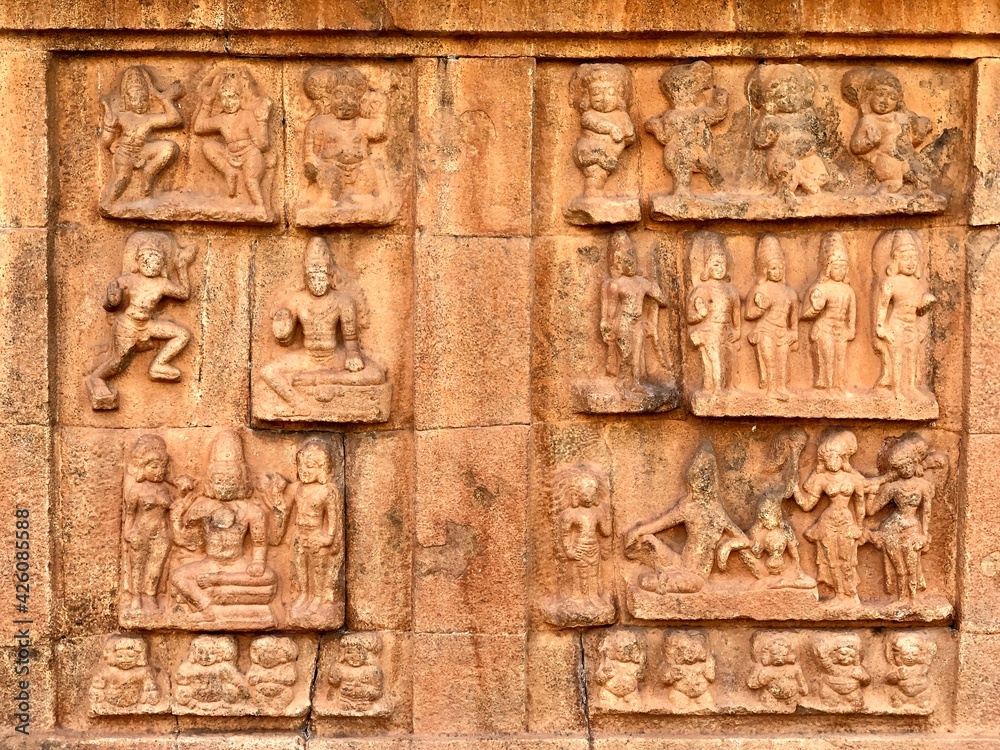 Bas relief ancient sculptures carved on the walls of historical Brihadeeswarar temple in Thanjavur, Tamilnadu. Indian rock art relief carvings of ancient God sculptures in temple walls in Tamilnadu.