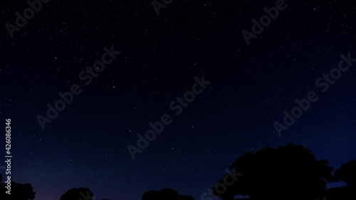 Astrophotography timelapse. Constellation of the Big Dipper (El Carro). In a place in the field with trees