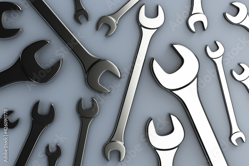 Lots of open-end wrenches on the table. Top view. Repair topics.