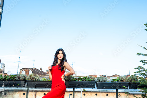 Woman wearing red dress outdoor © alipko