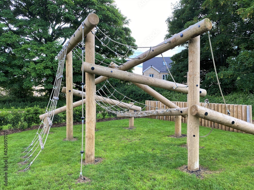 Wooden construction play area, in a grassy area, with old trees on, Calverley Lane, Leeds, UK Wooden construction play area, in a grassy area, with old trees on, Calverley Lane, Leeds, UK