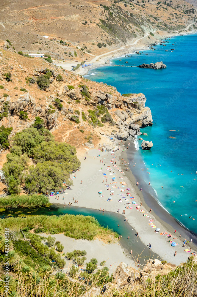 Panoramic View of Preveli Beach where the River Meats the Sea. Palm Tree Forest in one of the most Famous Tourist Attractions in the World. Summer in Crete, Greece