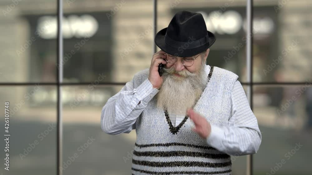 Confident senior man talking on cell phone. Confident senior man talking on cell phone.