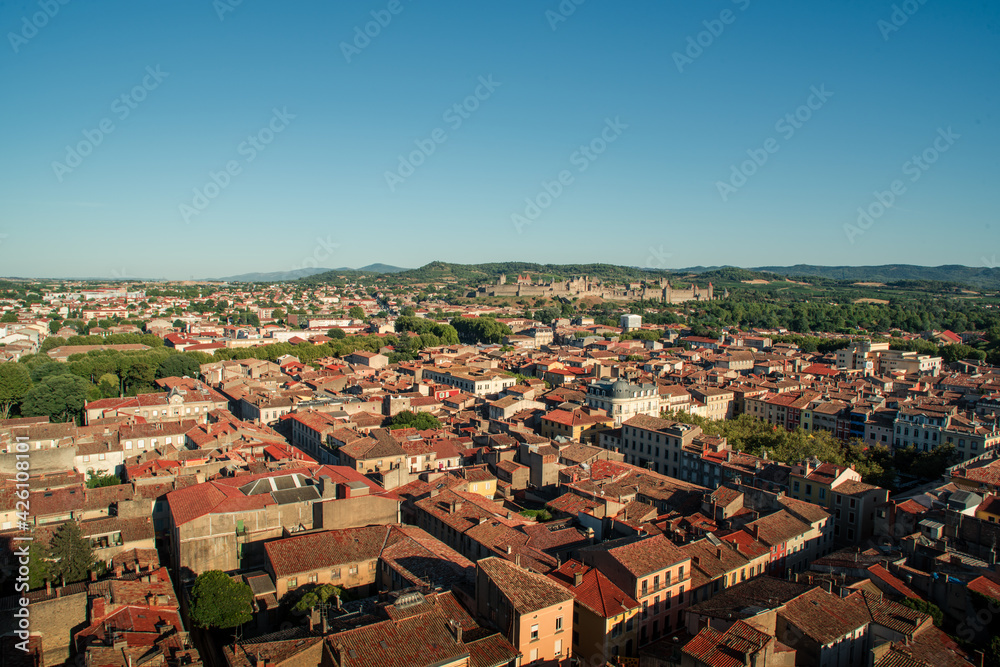 Aerial top view of Carcassonne city in France with the old fortress castle at the distance