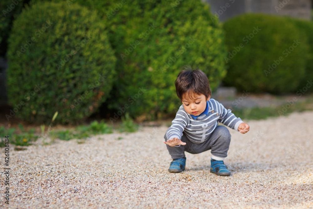 Portrait of a little eastern handsome baby boy playing outdoor in the park Portrait of a little eastern handsome baby boy playing outdoor in the park