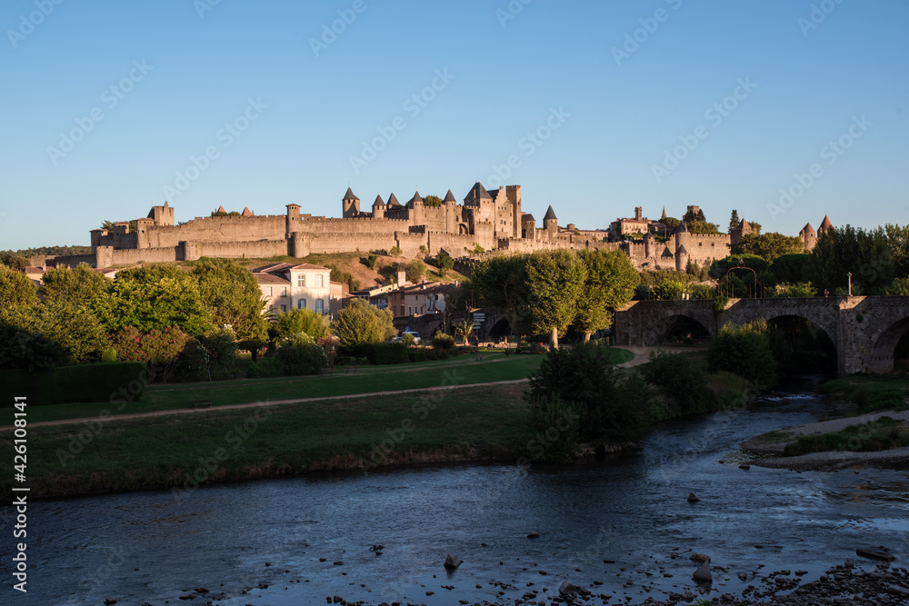 View of medieval town of Carcassone and the brige Le Pont Vieux in France.