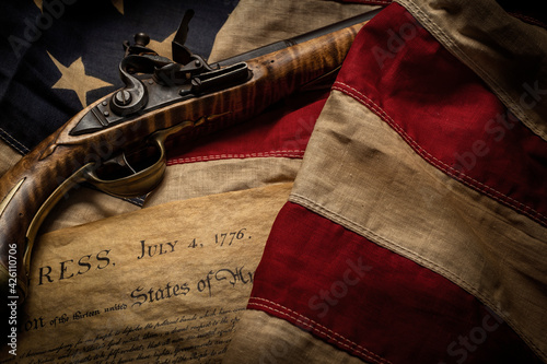 Flintlock pistol with American flag and Declaration of Independence photo