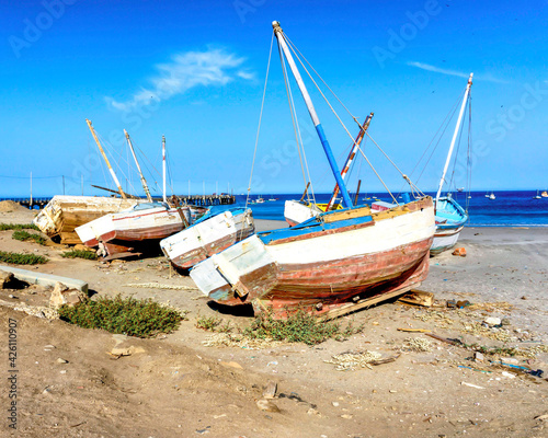 old sail boats on the beach