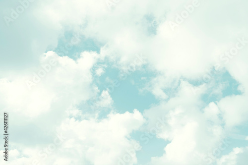 White cumulus clouds on blue sky photo
