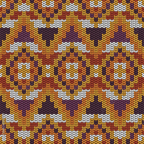 Geometric ornament of rhombuses and triangles in the native American style. Seamless pattern in knitted style for web, print, textile, wallpaper, card, wrapping paper and background