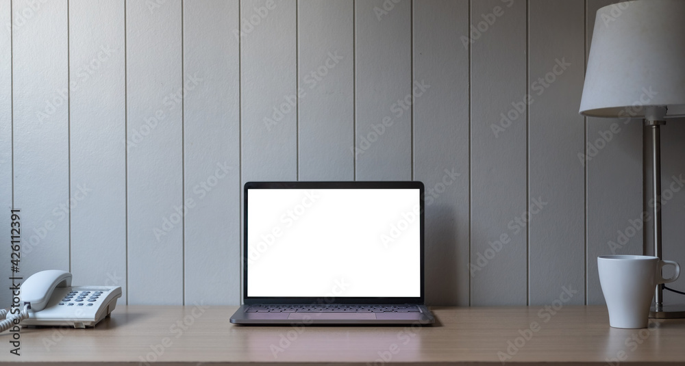 Cropped shot of minimal workspace with mock-up laptop, decorations and copy space. Cropped shot of minimal workspace with mock-up laptop, decorations and copy space.