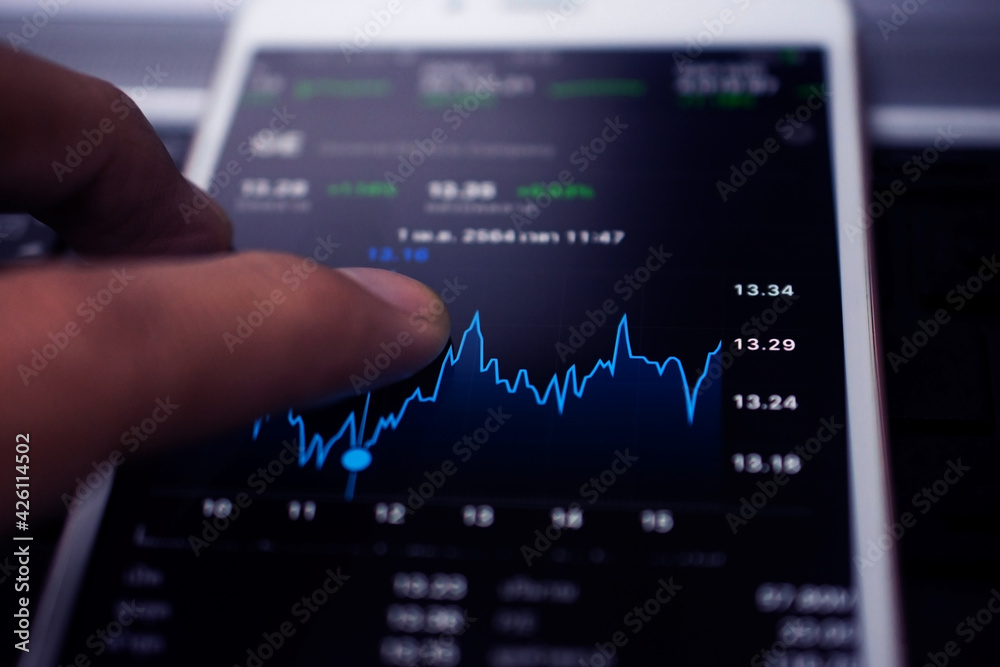 Hand using smartphone trade stock market online business technology Hand using smartphone trade stock market online business technology