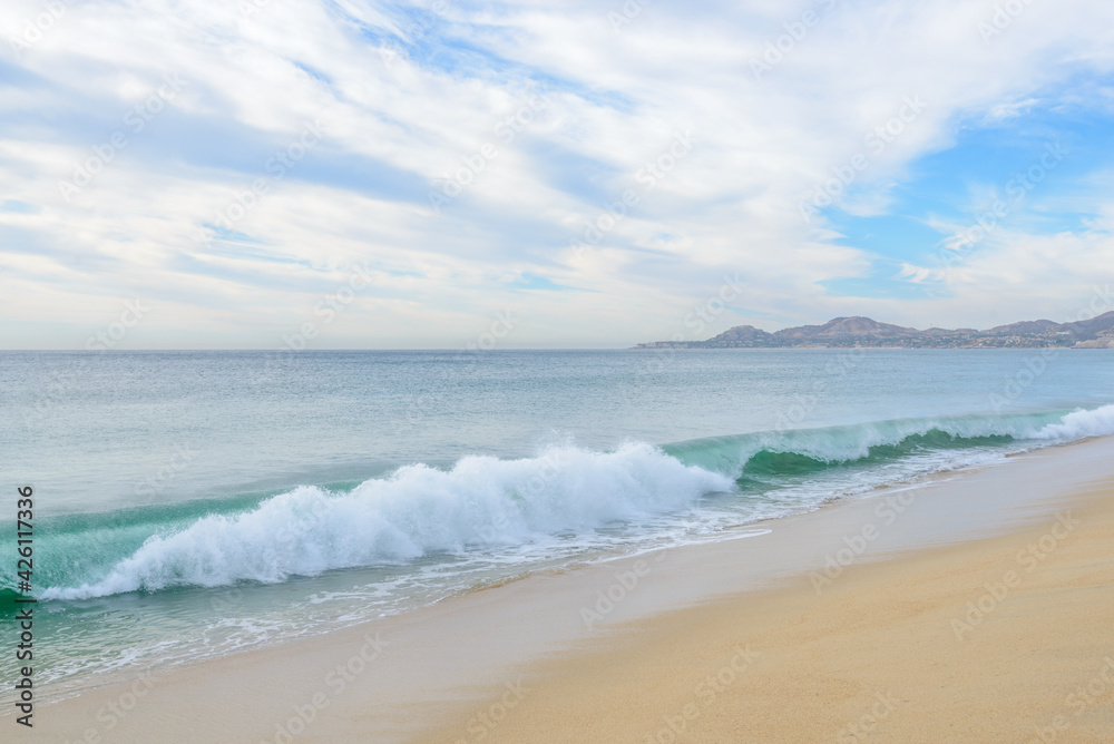 Set of pictures of a fantastic ocean wave in different stages. Cloudy sunrise sky. San Jose del Cabo. Mexico. Set of pictures of a fantastic ocean wave in different stages. Cloudy sunrise sky. San Jose del Cabo. Mexico.