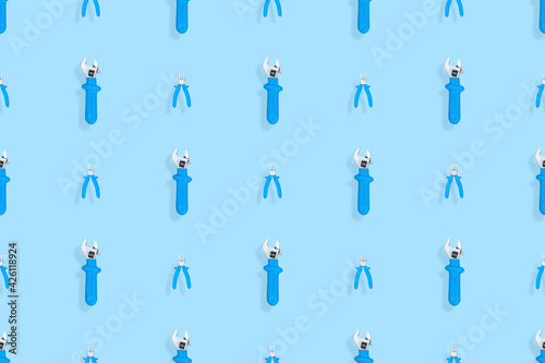 Tools seamless pattern. Background made of tools  pliers and an adjustable wrench.