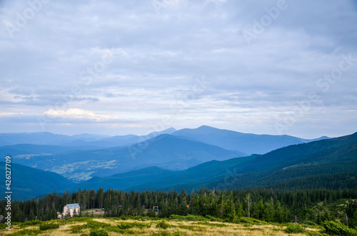 View from the mountain to the ski resort Dragobrat. Hoverla and petros mountines on background. Carpathian mountains, Ukraine © Dmytro