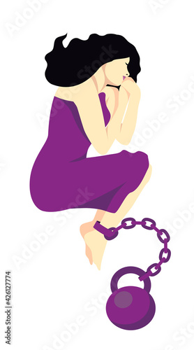 A young woman or girl lies in a purple dress chained to a weight. The concept of abuse, victims of narcissism, difficult memories of the past, lack of freedom, complex post-traumatic disorder.