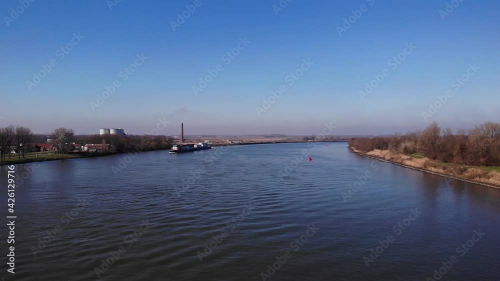 Oude Maas River On A Sunny Day With Blue Sky In Summer Near Puttershoek, Netherlands. - aerial