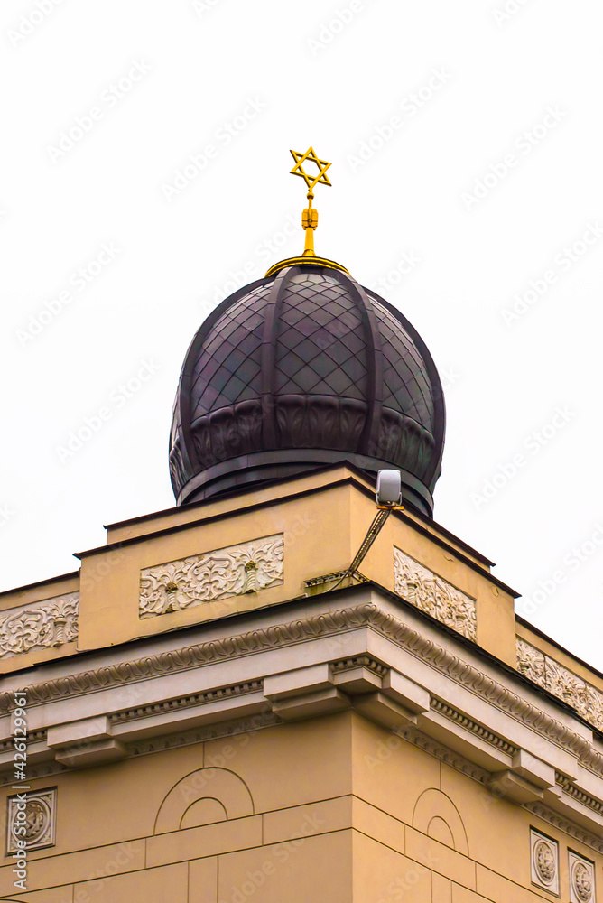 The roof of the synagogue. The golden star of David on the roof of the synagogue. Jewish culture.