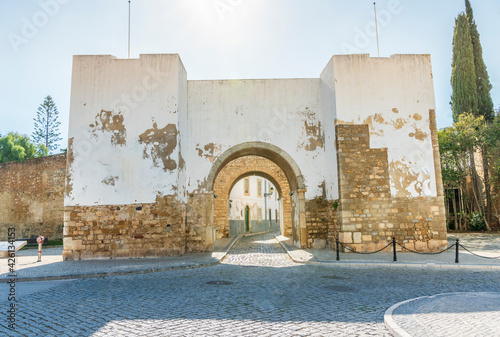 Entrance through medieval walls to historic downtown of Faro, Algarve, Portugal