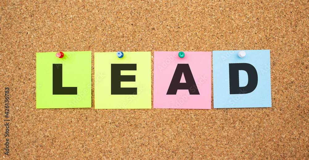 Color notes with letters pinned on a board. Word LEAD. Color notes with letters pinned on a board. Word LEAD.