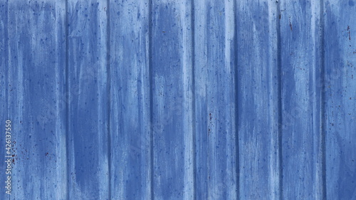 blue background of textured solid material painted blue and aged from time, empty blue backdrop with lines of planks, full frame of a fragment of a rustic metal or wooden fence