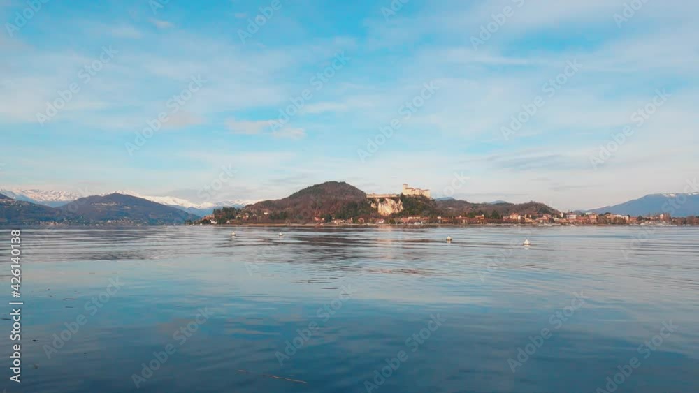 Maggiore Lake with Angera Castle in background. Low angle and static shot