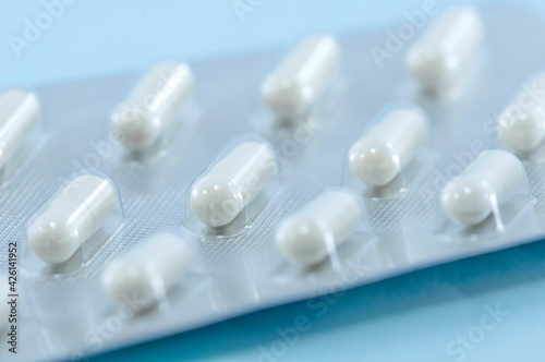 Blister of white pills closeup. Pharmacy