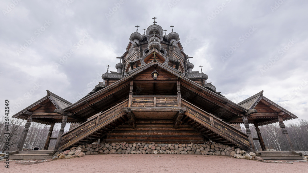An old wooden Orthodox church in the name of the Intercession of the Most Holy Theotokos. Russian wooden architecture. St. Petersburg, Russia.