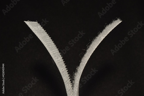 Velcro tape isolated on black background.