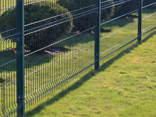 neat fence in the park, sports area of the city