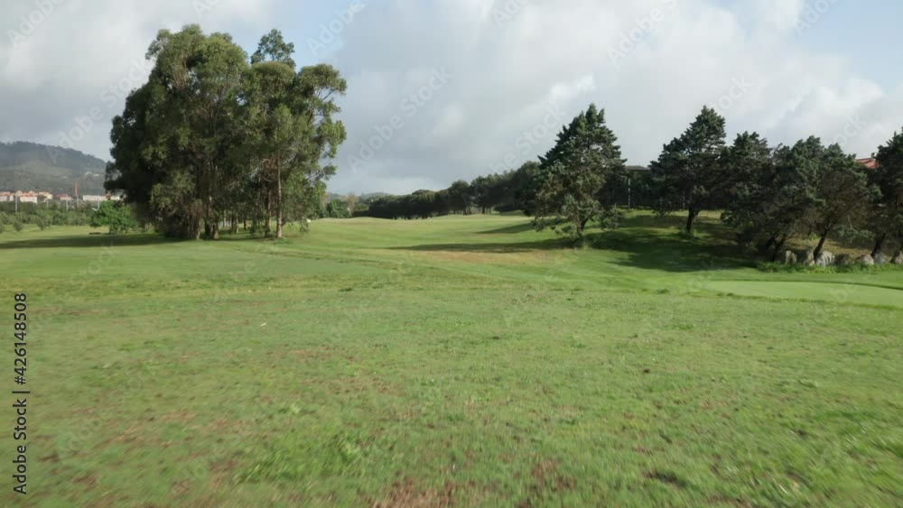 Flying Over The Beautiful Green Field Of Beloura Golf Course On A Sunny Day In Sintra-Lisbon, Portugal - Drone Forward Shot Flying Over The Beautiful Green Field Of Beloura Golf Course On A Sunny Day In Sintra-Lisbon, Portugal - Drone Forward Shot