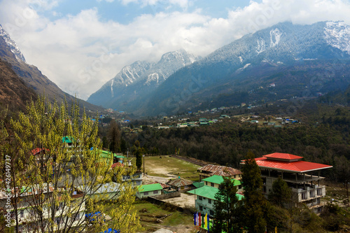 Beautiful Lachung village of North Sikkim, India with snow capped mountains in background photo