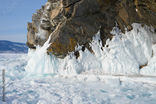 rock with splashes of frozen water in winter
