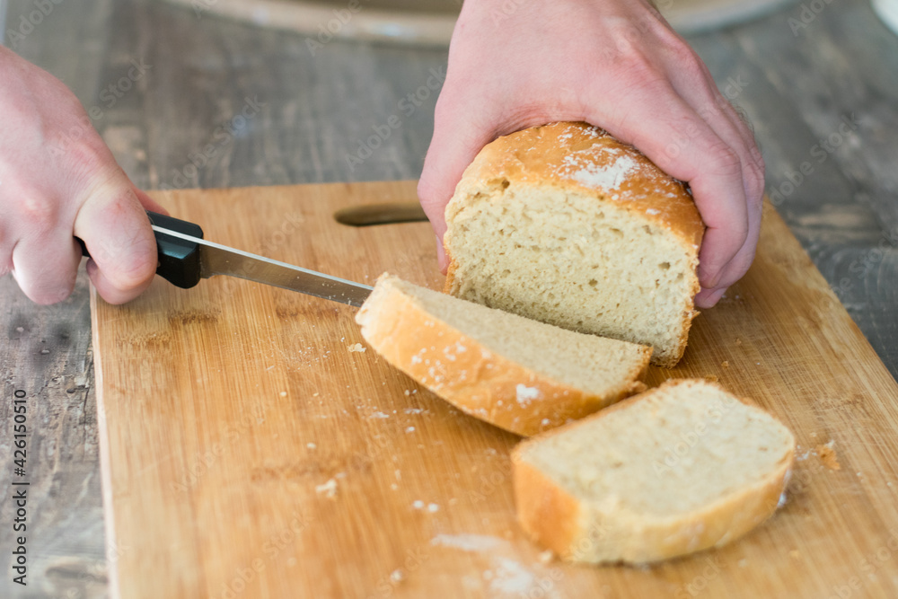 Homemade white wheat bread in the form. Step-by-step cooking process for baking at home in the oven. Homemade white wheat bread in the form. Step-by-step cooking process for baking at home in the oven.