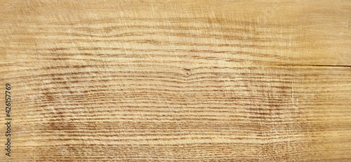 Top view of the old scratched wooden desk as a background