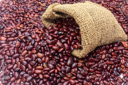 Fresh organic red kidney beans or rajma in a sackcloth bag. © Soumen