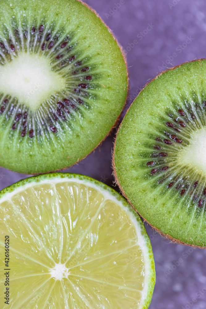 Close-up on the texture of cut fruit kiwi and lime top view Close-up on the texture of cut fruit kiwi and lime top view