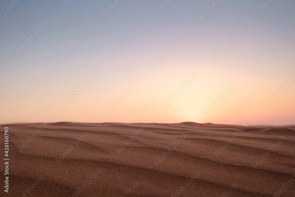 Sunset over the sand dunes in the desert. Sunset over the sand dunes in the desert.